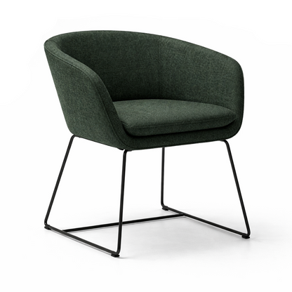 Green armchair with black metal legs on a white background