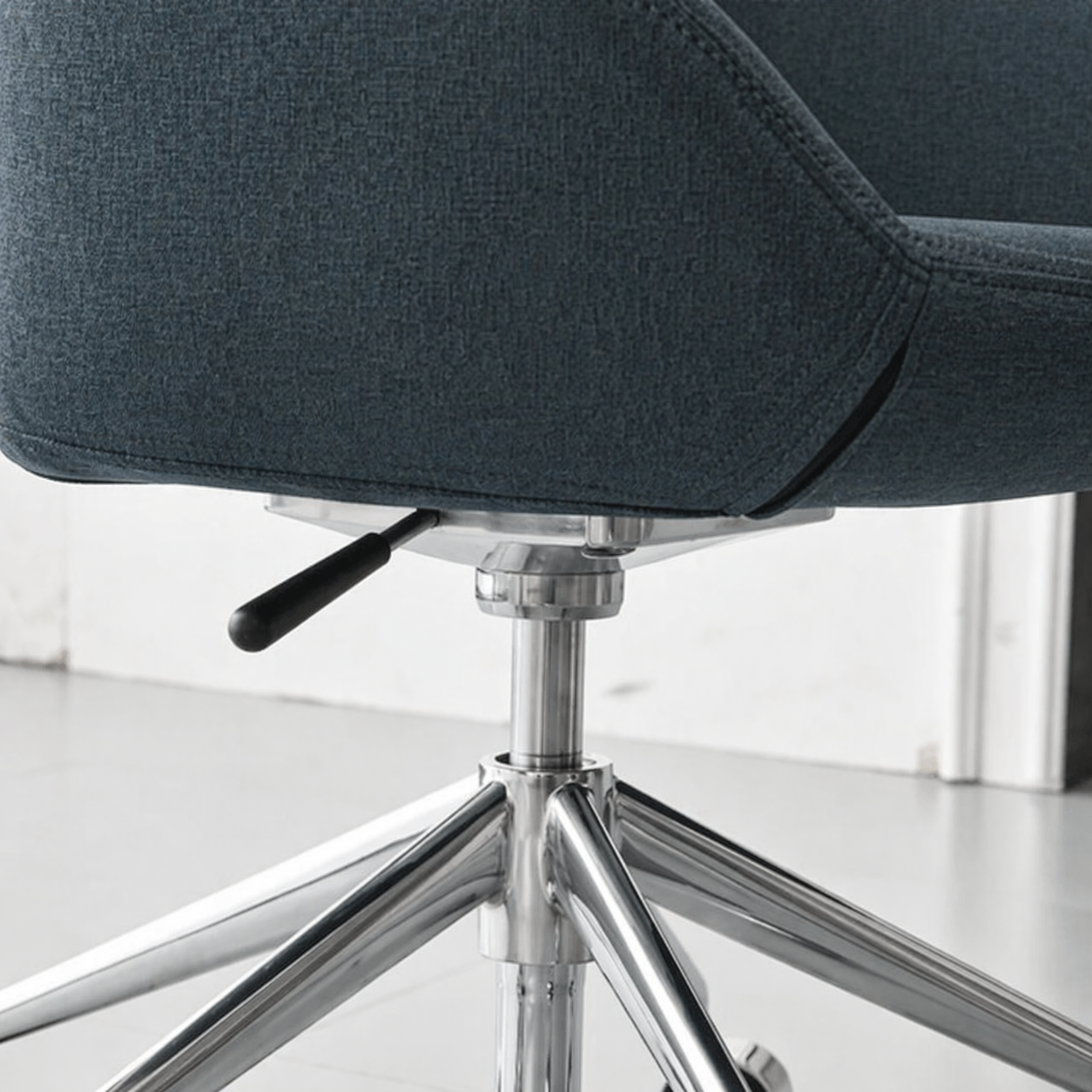 Blue office chair with chrome base on a white background